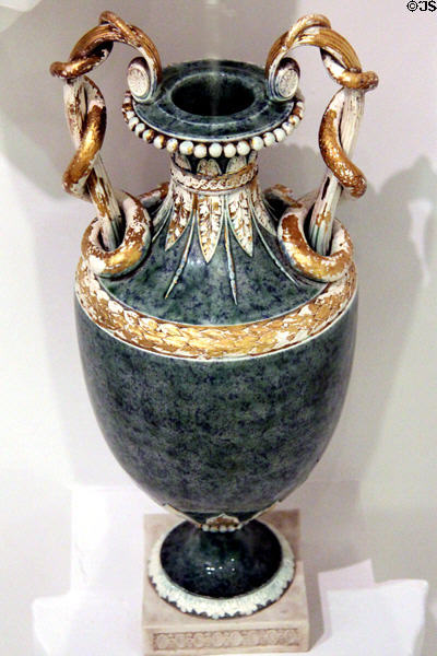 Porphyry-like ornamental stoneware vase with snake handles (1778-80) by Wedgwood at World of Wedgwood. Barlaston, Stoke, England.