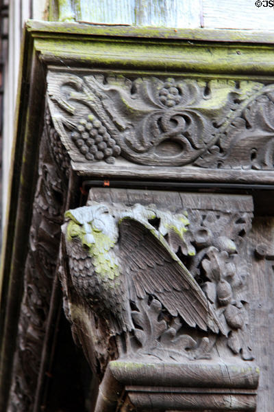 Carved wooden owl beside front door at Wightwick Manor. Wolverhampton, England.