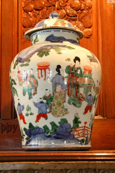 Chinese porcelain covered jar painted with figures in garden (c1650-65) (Ming to Qing period) in drawing room at Wightwick Manor. Wolverhampton, England.