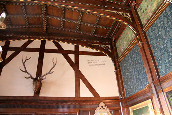 Elk head in Great Parlor at Wightwick Manor beside printed Orpheus lyre extract from St Cecilia's Day poem by Joseph Addison in Great Parlor at Wightwick Manor. Wolverhampton, England.