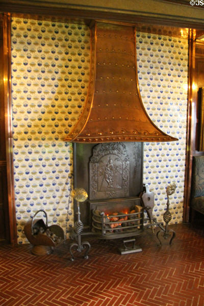 Billiard room fireplace (1893) with some metal parts possibly by Morris & Co surrounded by Dutch tiles at Wightwick Manor. Wolverhampton, England.