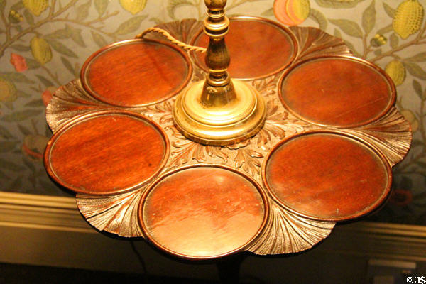 Small round table with circular flat compartments used in Georgian times for serving breakfasts, teas or deserts at Wightwick Manor. Wolverhampton, England.