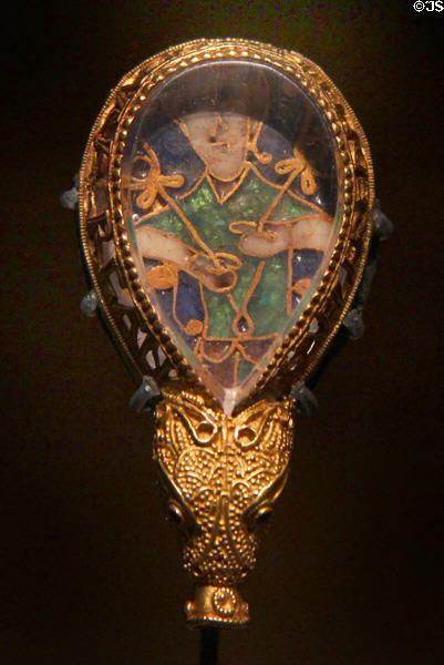 Anglo-Saxon "Alfred Jewel" of cloisonné enamel under rock crystal in gold frame (871-899) so named because on inscription which translates to 'Alfred ordered me to be made' at Ashmolean Museum. Oxford, England.