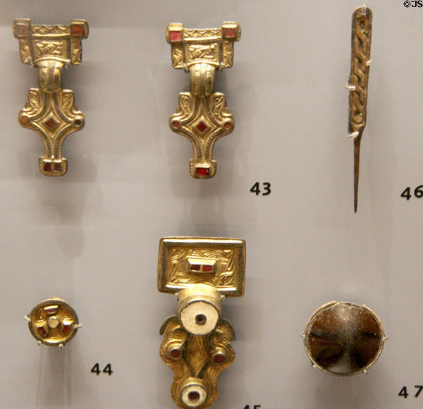 Anglo-Saxon silver gilt brooches, pinbeater & pendant with garnets (500-650) found in female burial at Ashmolean Museum. Oxford, England.