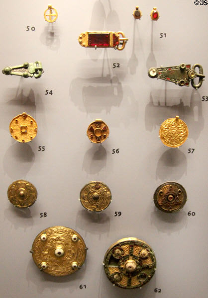 Anglo-Saxon gold, silver or copper brooches, buckles & pendant with garnets, ivory (550-700) found in southern English burials at Ashmolean Museum. Oxford, England.