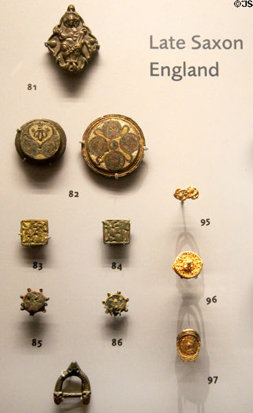 Late Anglo-Saxon bronze or copper brooches, buckles & discs with enamel & Viking influence (950-1100) found in English burials at Ashmolean Museum. Oxford, England.