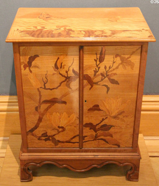 Two-doors side cabinet with marquetry of magnolia branches, butterflies & flowers (1900) from France at Ashmolean Museum. Oxford, England.