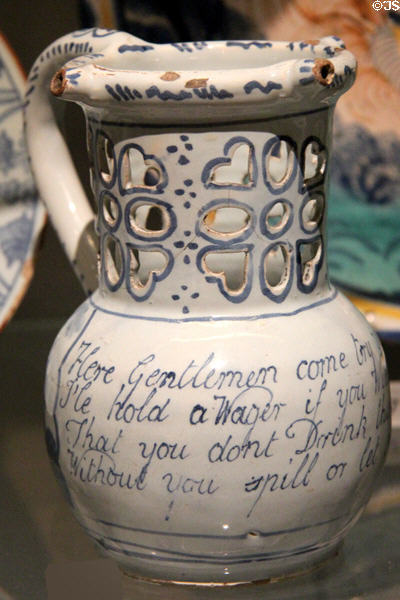 Earthenware puzzle jug (c1750-70) from Liverpool at Ashmolean Museum. Oxford, England.