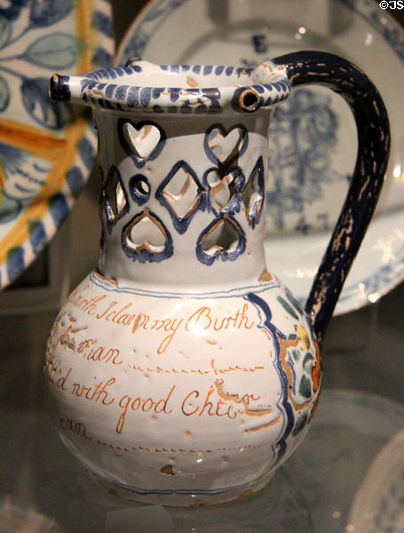 Earthenware puzzle jug (c1755-75) from Liverpool at Ashmolean Museum. Oxford, England.