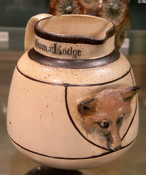 Salt glazed stoneware jug with fox's face (1885) by Martin Brothers of Fulham at Ashmolean Museum. Oxford, England.