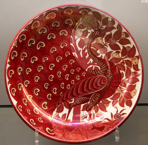 Ruby lustre peacock dish (1888-1907) by Charles Passenger for William De Morgan at Ashmolean Museum. Oxford, England.