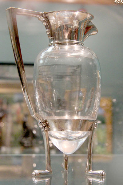 Electroplated nickel silver& glass skate foot decanter (1879) by Christopher Dresser made by Hukin & Heath of Birmingham at Ashmolean Museum. Oxford, England.