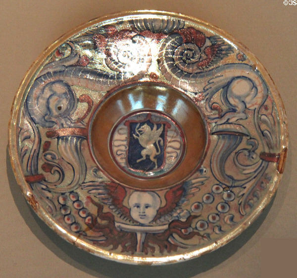 Maiolica plate with arms of Perugia? (c1525) by workshop of Maestro Giorgio Andreoli of Gubbio at Ashmolean Museum. Oxford, England.