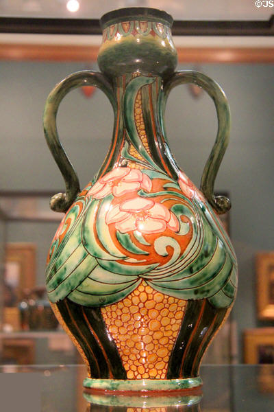 Earthenware two-handled vase (c1905) by Charles Collis for Della Robbia Pottery of Italy at Ashmolean Museum. Oxford, England.