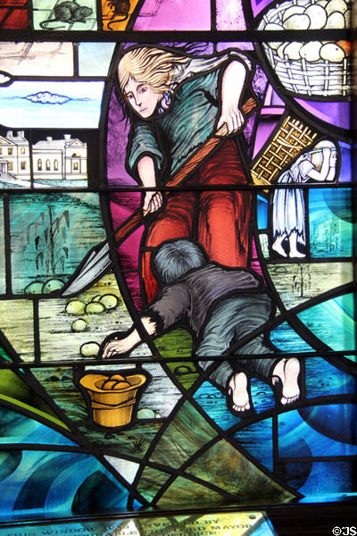 Detail of potato digger on Ireland Famine window (1999) at Belfast City Hall. Belfast, Northern Ireland.