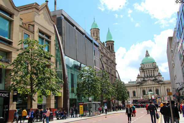 Streetscape of Donegall Place with Belfast City Hall in distance. Belfast, Northern Ireland.