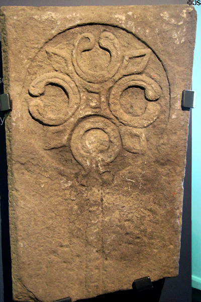 Grave-slab or coffin lid with cross in Anglo-Norman style (13thC) from County Down at Ulster Museum. Belfast, Northern Ireland.