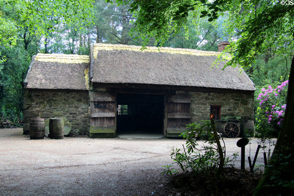 Thatched forge building (1800s) at Ulster American Folk Park. Omagh, Northern Ireland.