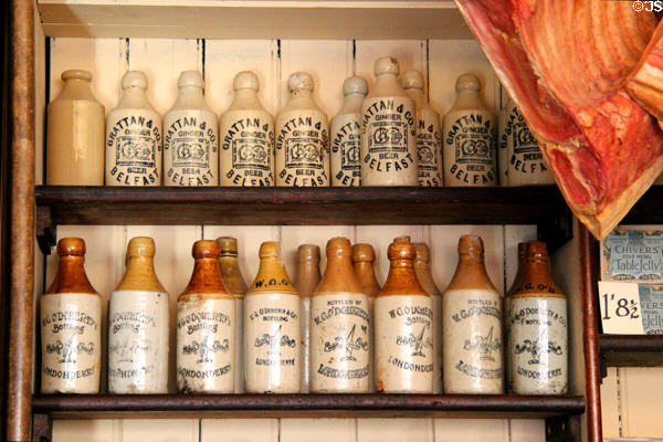 Stoneware bottles in W G O'Doherty Licensed Grocery shop at Ulster American Folk Park. Omagh, Northern Ireland.
