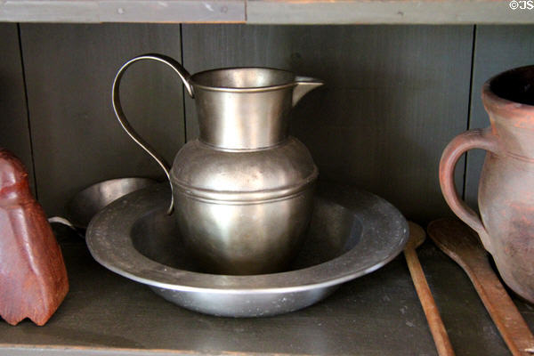 Pewter pitcher & basin in West Virginia McCallister House at Ulster American Folk Park. Omagh, Northern Ireland.