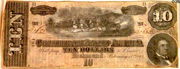 Confederate $10 bill (1864) shows galloping mounted artillery at Ulster American Folk Park. Omagh, Northern Ireland.