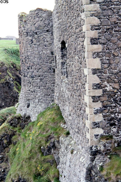 Stone walls of Dunluce Castle (13thC). Northern Ireland.