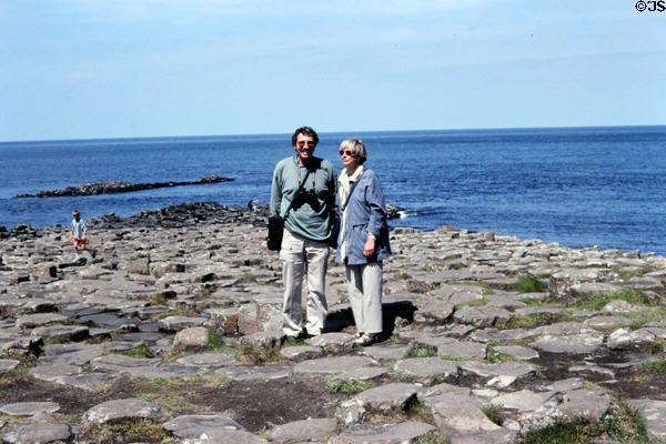 Visitors walk Giant's Causeway. Northern Ireland.