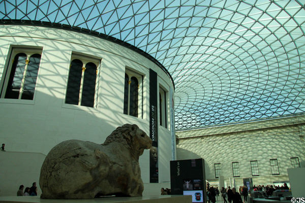 Glass atrium of Queen Elizabeth Great Court (2003) of British Museum over Reading Room & Stone Lion. London, United Kingdom.