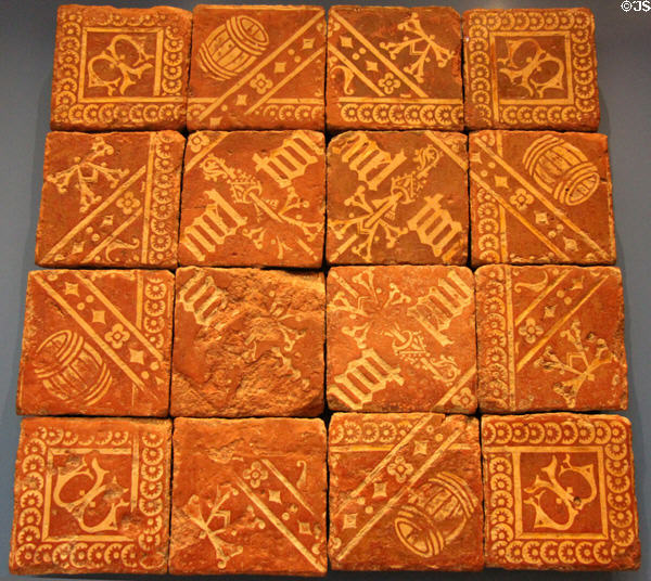 Lead-glazed earthenware initialed floor tiles from an abbot's room (1525-40) found near Hailes Abbey Gloucestershire at British Museum. London, United Kingdom.