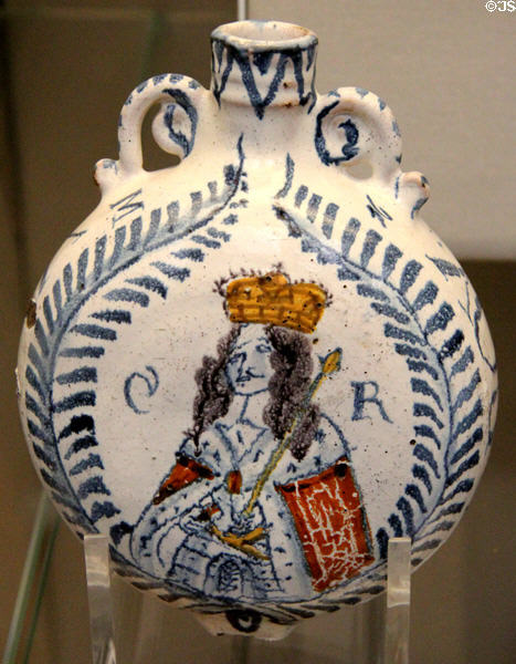 Earthenware tin-glazed wine flask with painted bust of King Charles II (1668) at British Museum. London, United Kingdom.