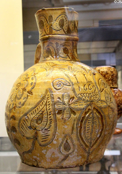 Lead-glazed earthenware harvest jug (1669) prob made by John Leachland of Barnstaple, North Devon at British Museum. London, United Kingdom.