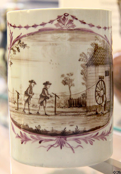 Porcelain mug painted with scene of rope making driven by spinning wheel (1785) by Lowestoft factory near Suffolk at British Museum. London, United Kingdom.