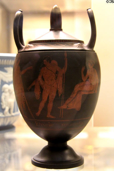 Black Basalt vase with red encaustic decoration (June 13, 1769 - First Day of Etruria factory) by Josiah Wedgwood with partner Thomas Bentley turning potter's wheel with design copied from ancient Greek vase (now also in British Museum) at British Museum. London, United Kingdom.