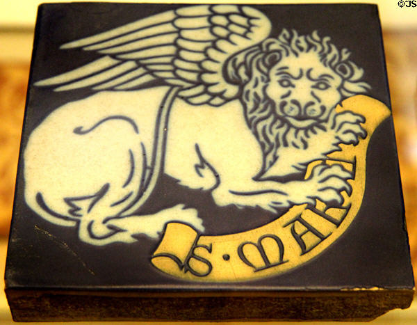Earthenware encaustic tiles with winged lion symbol of Evangelist St Mark (c1860) by Minton & Co at British Museum. London, United Kingdom.
