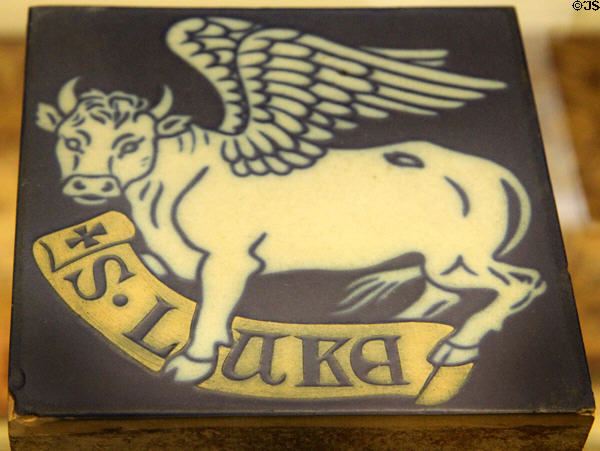 Earthenware encaustic tiles with winged bull symbol of Evangelist St Luke (c1860) by Minton & Co at British Museum. London, United Kingdom.