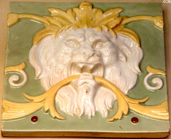 Earthenware tile with lion mask (c1870) by Minton & Co of Stoke-on-Trent at British Museum. London, United Kingdom.