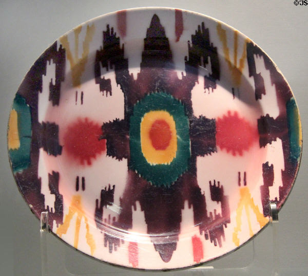 Russian earthenware plate with ikat textile pattern (1892-1917) by M.S. Kuznetsov factory at British Museum. London, United Kingdom.