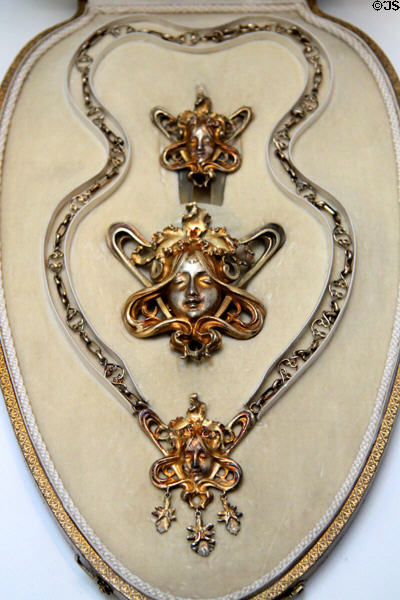 Art Nouveau set of silver-gilt jewelry (hair comb; waist clasp; necklace) (c1900) made by Janvier Quercia of France at British Museum. London, United Kingdom.