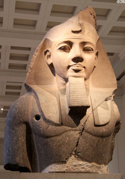 Upper part of seated granite statue of Ramesses II (19th Dynasty - c1270 BCE) from Thebes at British Museum. London, United Kingdom.