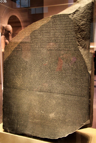 Rosetta Stone is inscribed with three versions of a decree: Ancient Egyptian in hieroglyphics & Demotic scripts plus Ancient Greek which was used to decode the top two writings. (Ptolemaic Dynasty - 196 BCE) at British Museum. London, United Kingdom.