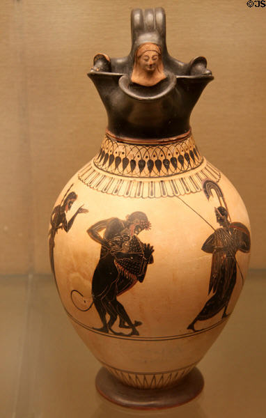 Greek terracotta white-ground oinochoe (wine jug) with Heracles & Nemean lion (c520-500 BCE) attrib. to painter of London made in Athens found in Vulci in Etruria at British Museum. London, United Kingdom.