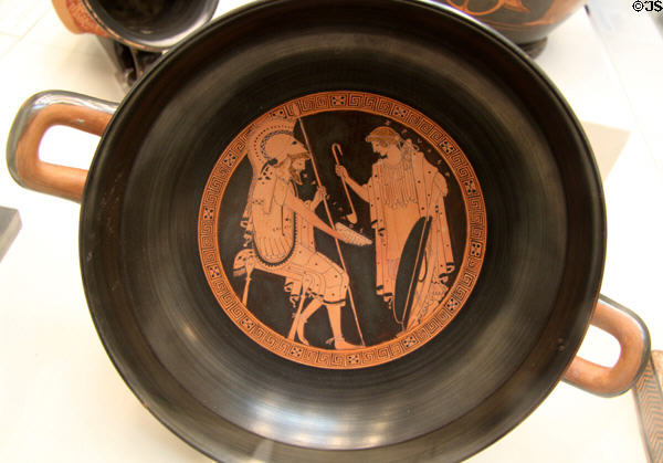 Greek terracotta red figure kylix (wine cup) with Zeuxo pouring wine for Chrysippos (c490-480 BCE) attrib. to Brygos painter made in Athens at British Museum. London, United Kingdom.