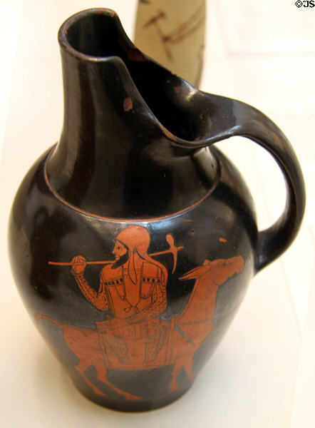 Greek terracotta red figure oinochoe (wine jug) with Persian soldier mocked sitting on a mule (c470 BCE) made in Athens at British Museum. London, United Kingdom.