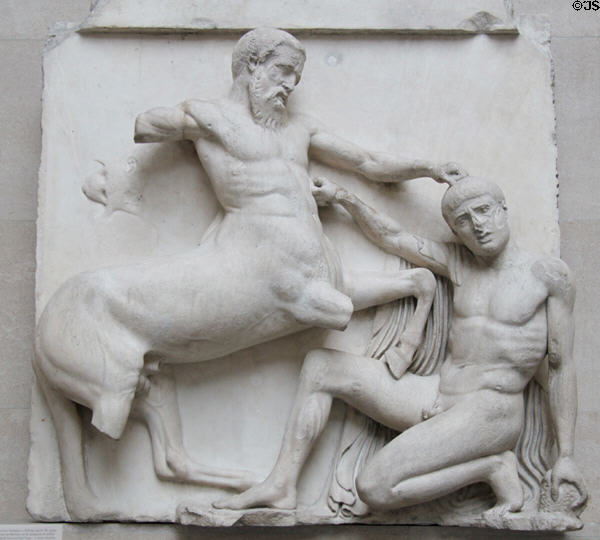 Centaur tramples a falling Lapith who reaches for a stone in defense marble metope section (south XXX) of Athens Parthenon Frieze (447-438 BCE) by Pheidias at British Museum. London, United Kingdom.