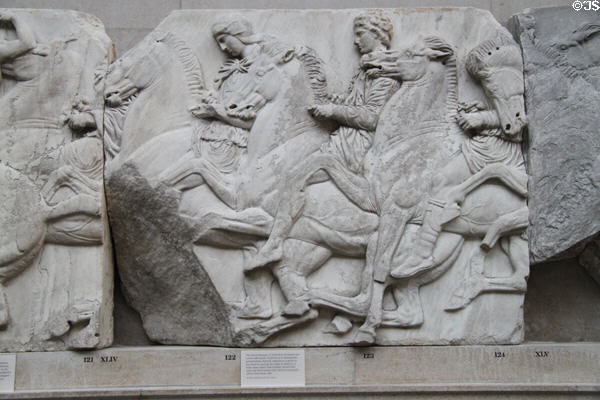 Panathenaic festival horsemen procession marble relief (Block XLIV) from north frieze of Athens Parthenon (447-438 BCE) by Pheidias at British Museum. London, United Kingdom.