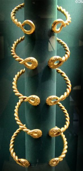Five gold torcs with cast decorations on end (c75 BCE) by Celtic culture found Ipswich, Suffolk at British Museum. London, United Kingdom.