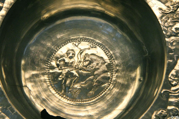 Detail of Roman flanged silver bowl showing with man spearing bear (4thC CE) part of Mildenhall Treasure at British Museum. London, United Kingdom.