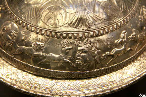 Roman flanged silver bowl showing Bacchus in profile between satyr being attacked by spotted cats (4thC CE) part of Mildenhall Treasure at British Museum. London, United Kingdom.