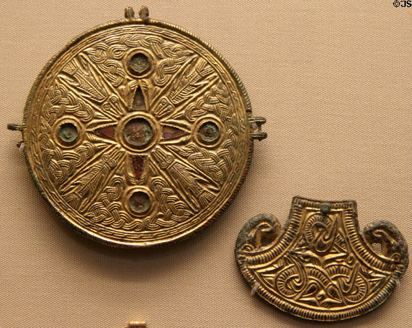 Anglo-Saxon harness fitting (6thC) from Hardingtone & bird shaped brooch (early 7thC) from Suffolk at British Museum. London, United Kingdom.