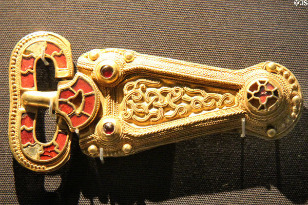 Anglo-Saxon gold buckle with garnets, glass & beaded wire (late 6thC) from Taplow, Buckinghamshire at British Museum. London, United Kingdom.